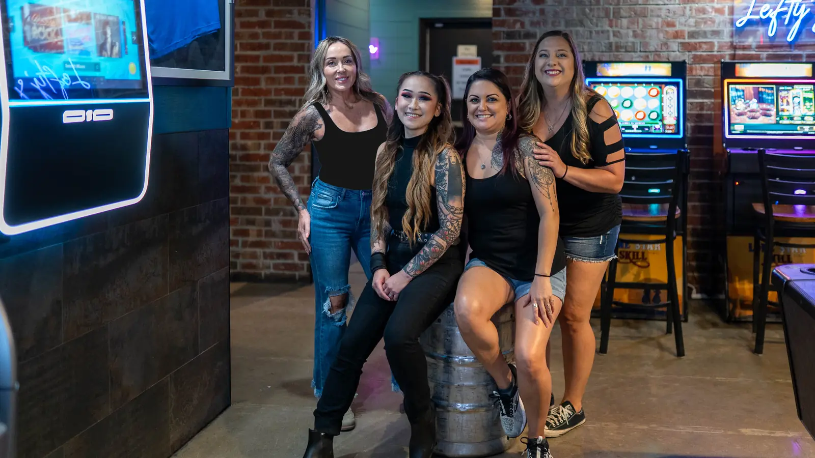 The Lefty's Draft House crew by the jukebox and game machines