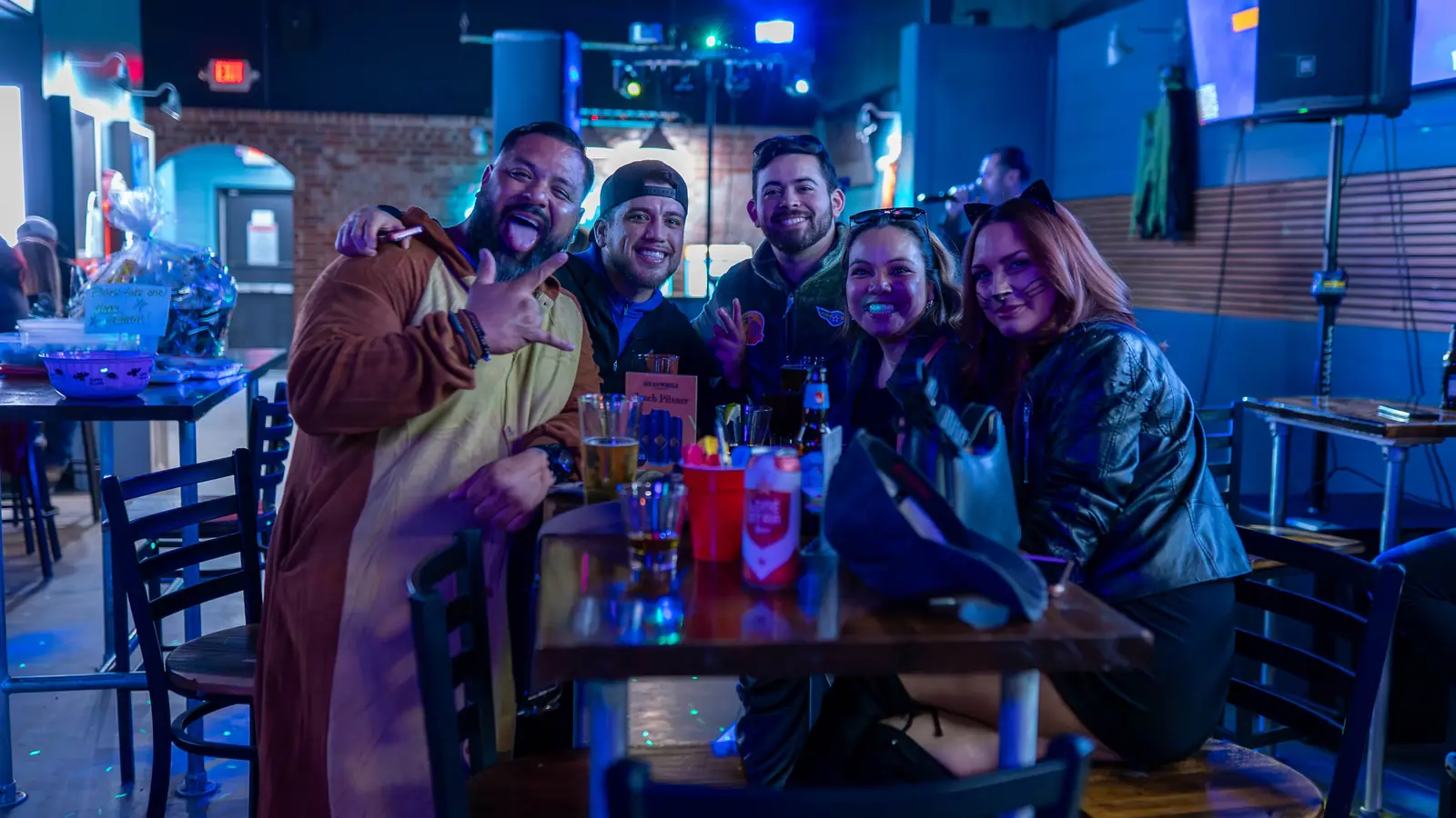 Regulars gathered around a table at Lefty's sports bar in San Antonio