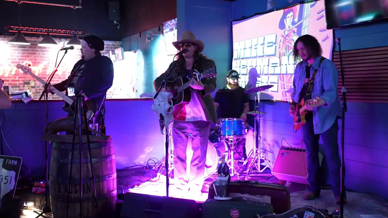 Live band playing under purple stage lights at Lefty's live music bar in San Antonio