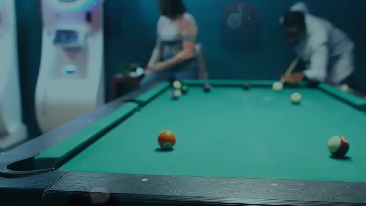 Friends playing pool at Lefty's Draft House